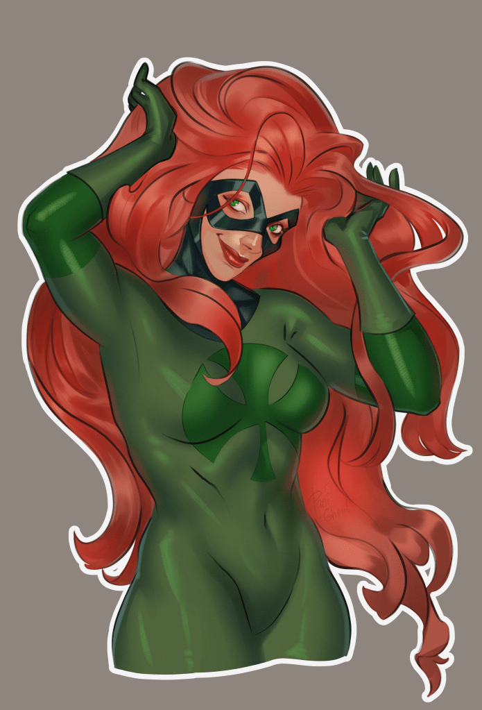 The superhero Shamrock. A woman with flowing red hair and a green costume featuring a shamrock logo.