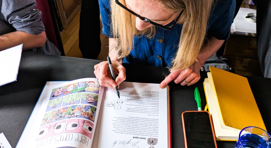 A woman sketching a comic