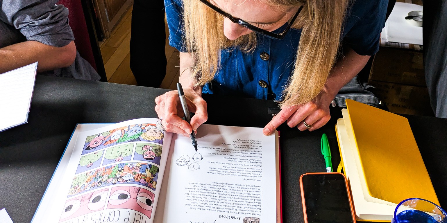 A woman sketching a comic