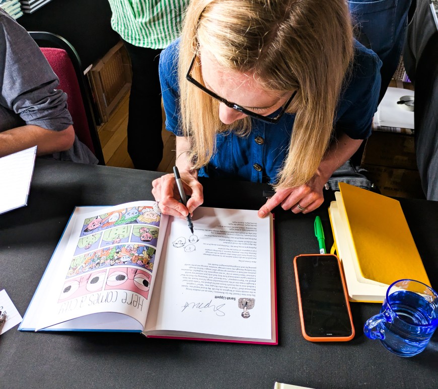 A woman sketching a comic