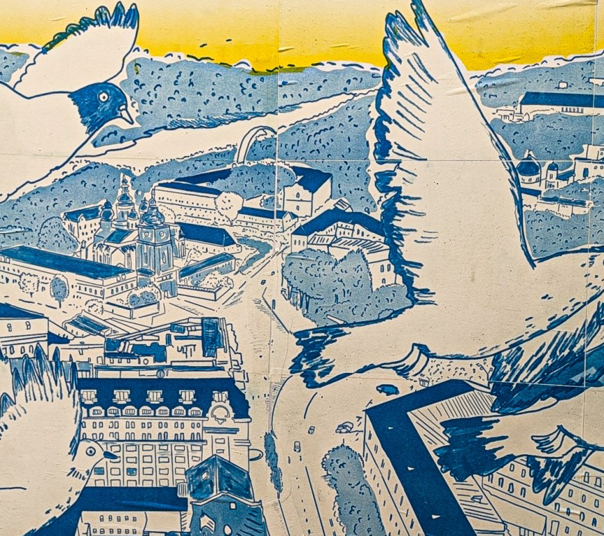 Pigeons in flight over a city