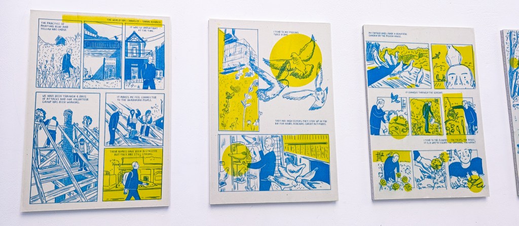 Three pages from the book on display as part of an exhibition